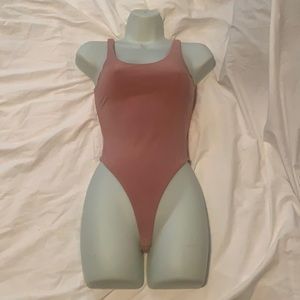 Tan pink body suit